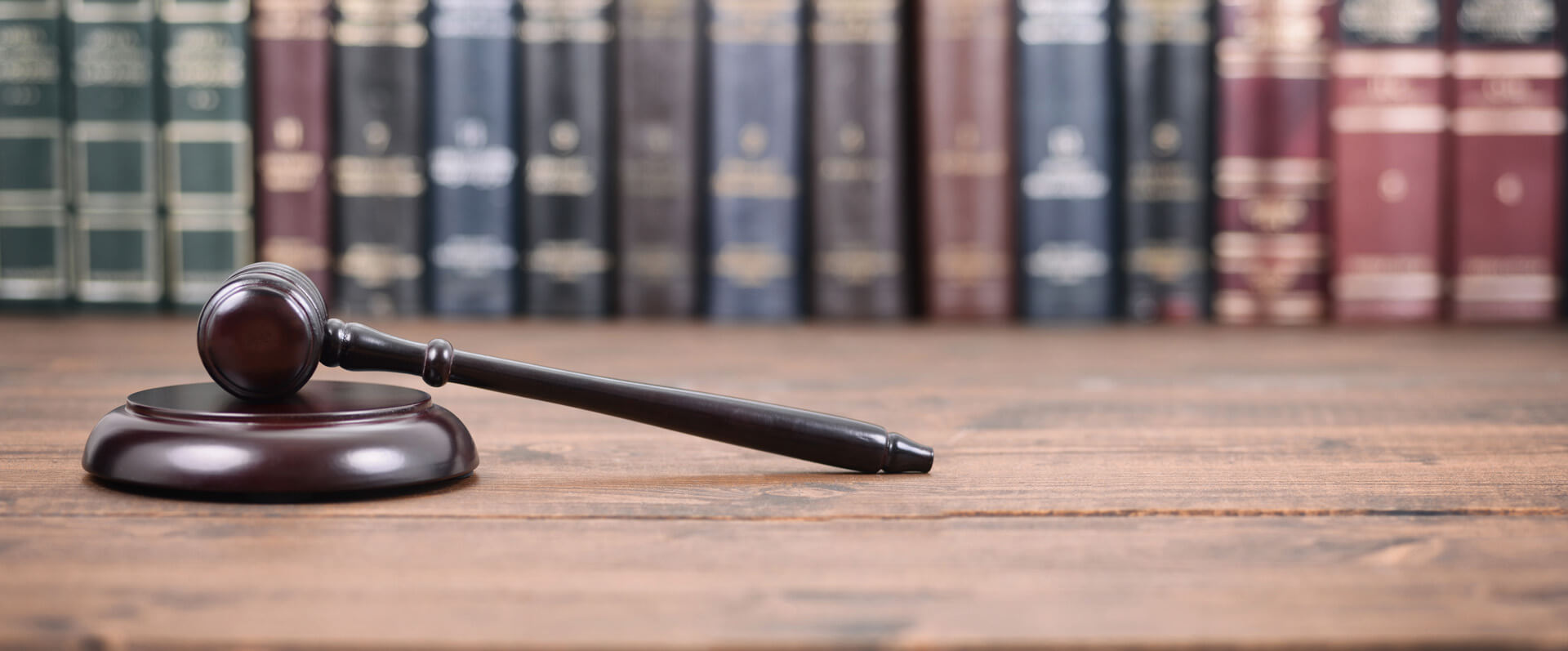 Judge Gavel on a wooden background, Law library concept.